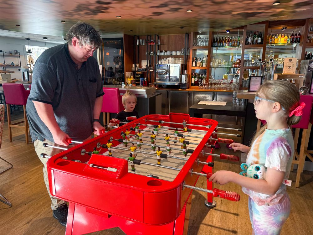 My husband, Sophie and Thomas playing table football