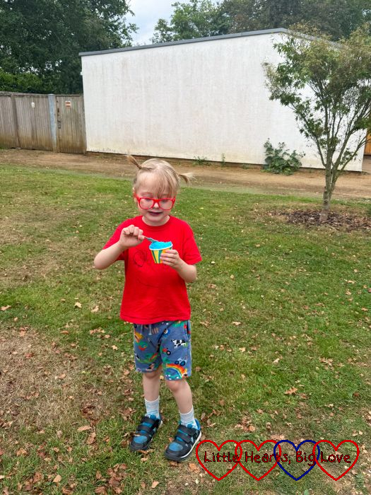 Thomas eating an ice-cream at the park