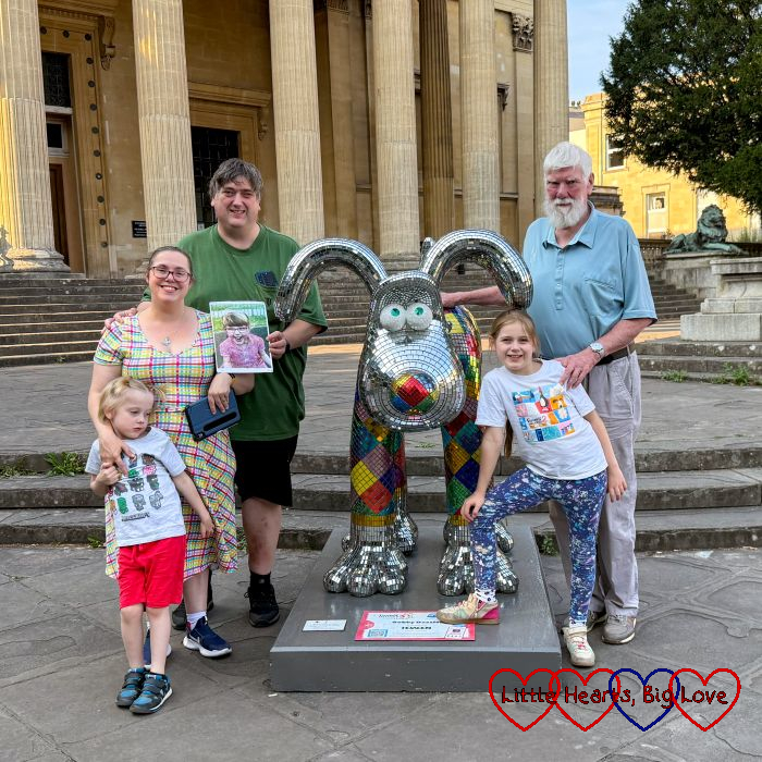 Me, my husband (holding a picture of Jessica), my father-in-law, Sophie and Thomas at one of the Gromit Unleashed 3 sculptures
