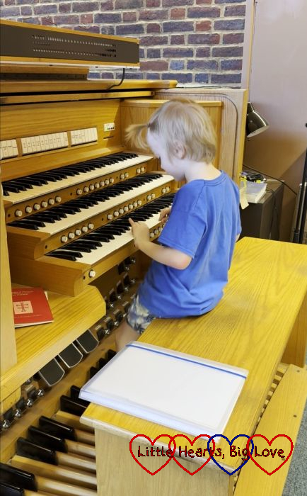 Thomas having a go at playing the organ at church