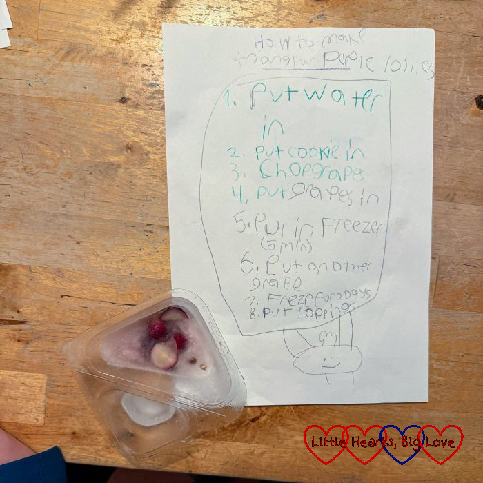 A recipe for 'purple triangular lollies' next to a yogurt container filled with ice and grapes