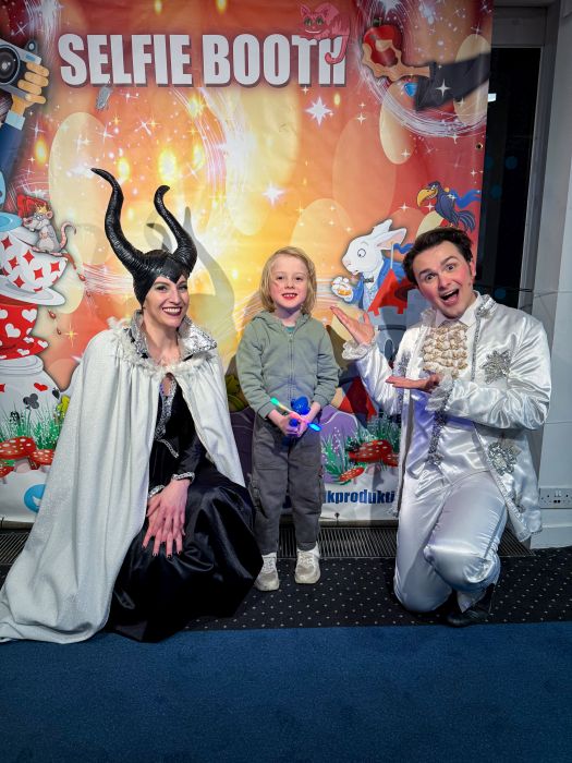 Thomas with two of the cast members of the panto