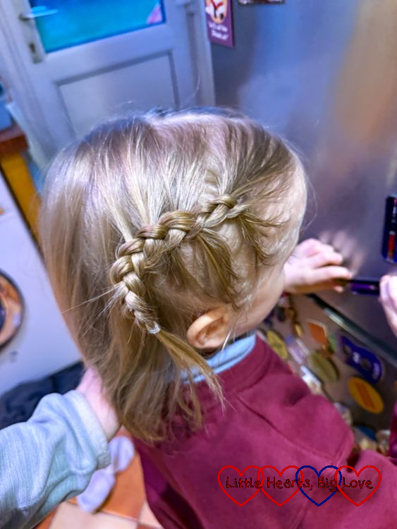 Thomas with his hair plaited