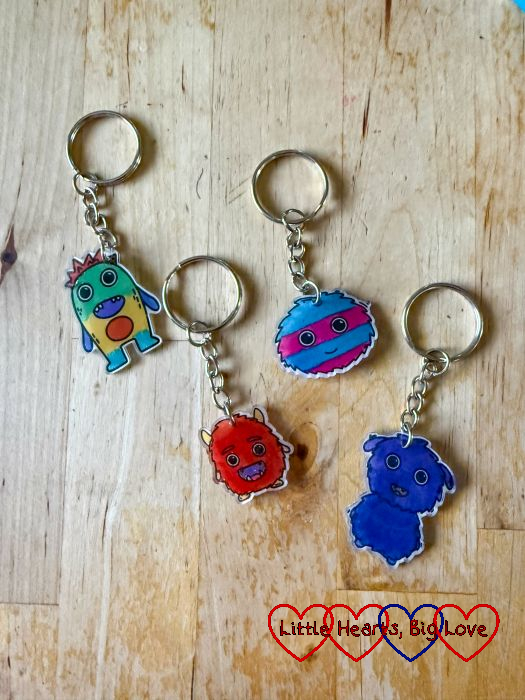 Four plastic monster shrinkie leyrings