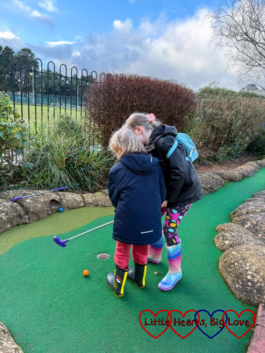 Thomas and Sophie playing crazy golf