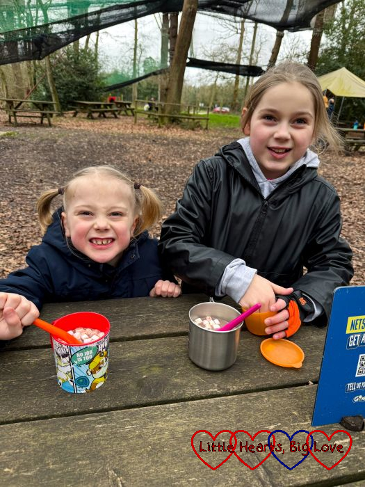 Thomas and Sophie enjoying hot chocolate outdoors