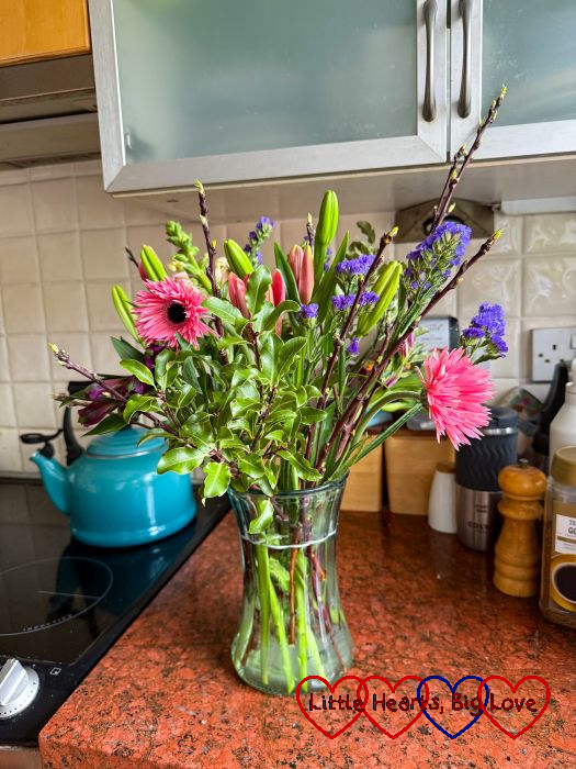 Pink and purple flowers in a vase