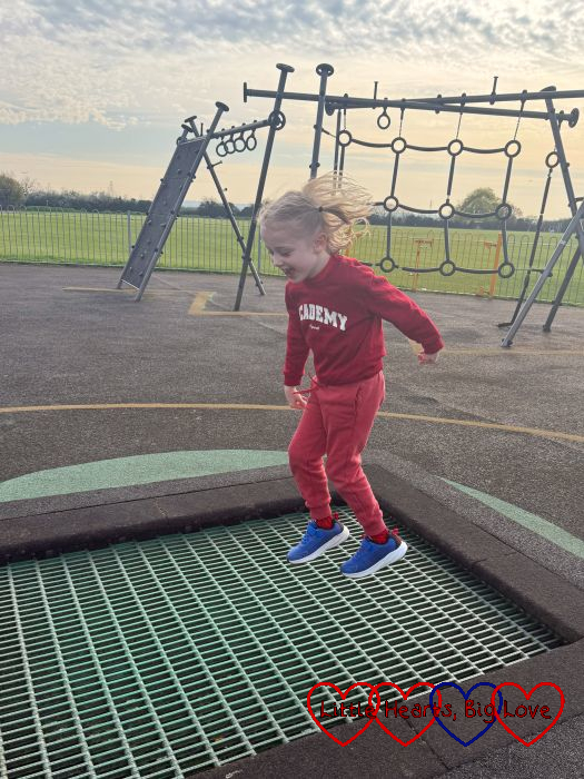Thomas bouncing on a trampoline at the park
