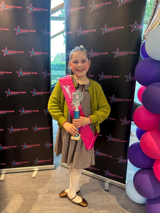 Sophie with her Miss Bright Star sash and trophy