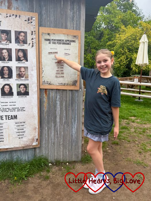 Sophie pointing out her name on the cast board