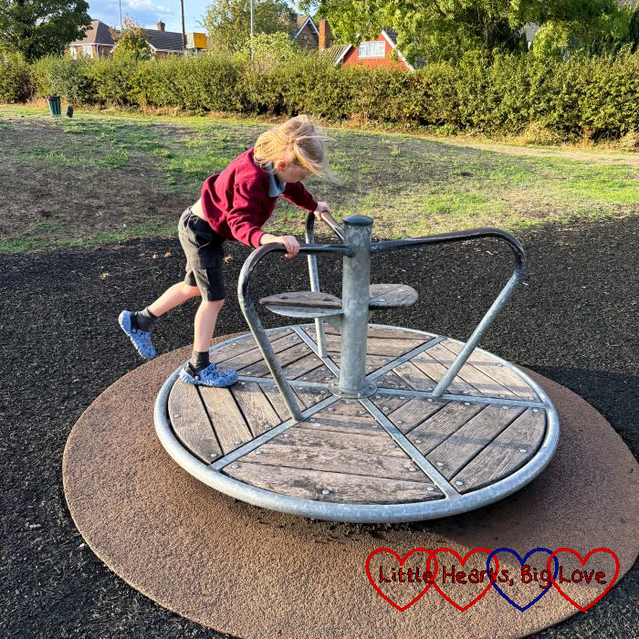 Thomas on a roundabout at a playground