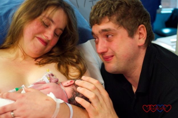 A tearful hubby looking at me having skin to skin with Jessica in the neonatal unit