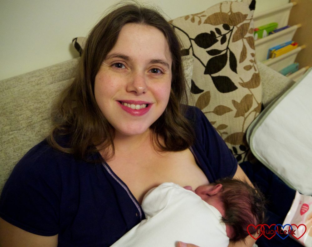 Me breastfeeding Sophie on the day she was born