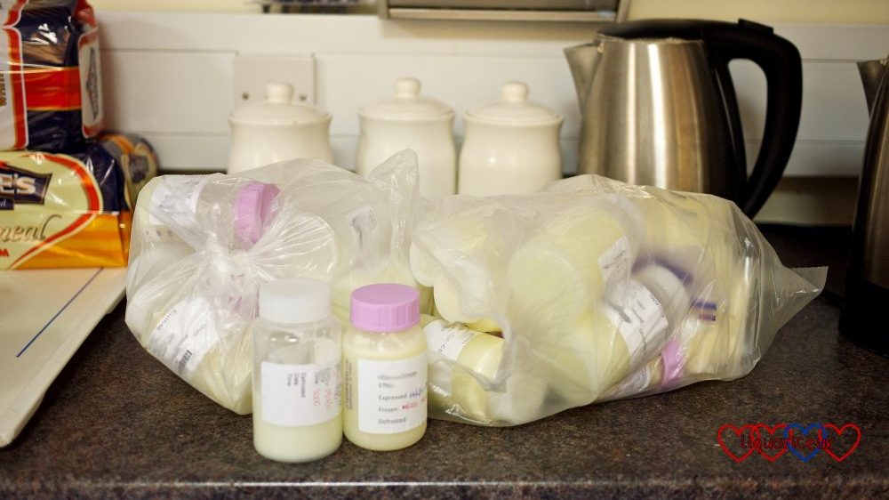A bag of little bottles of frozen expressed breast milk 