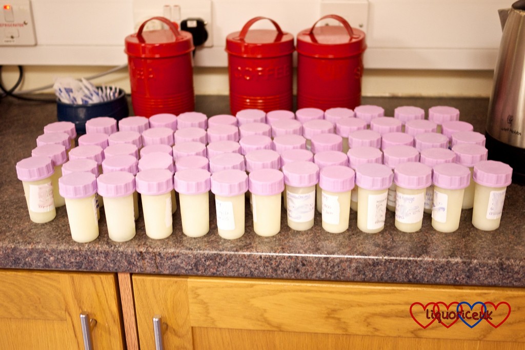Small containers of frozen expressed breastmilk