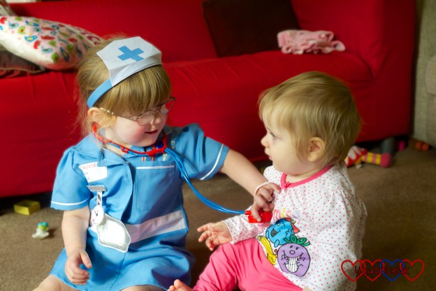 Jessica playing nurse with Sophie
