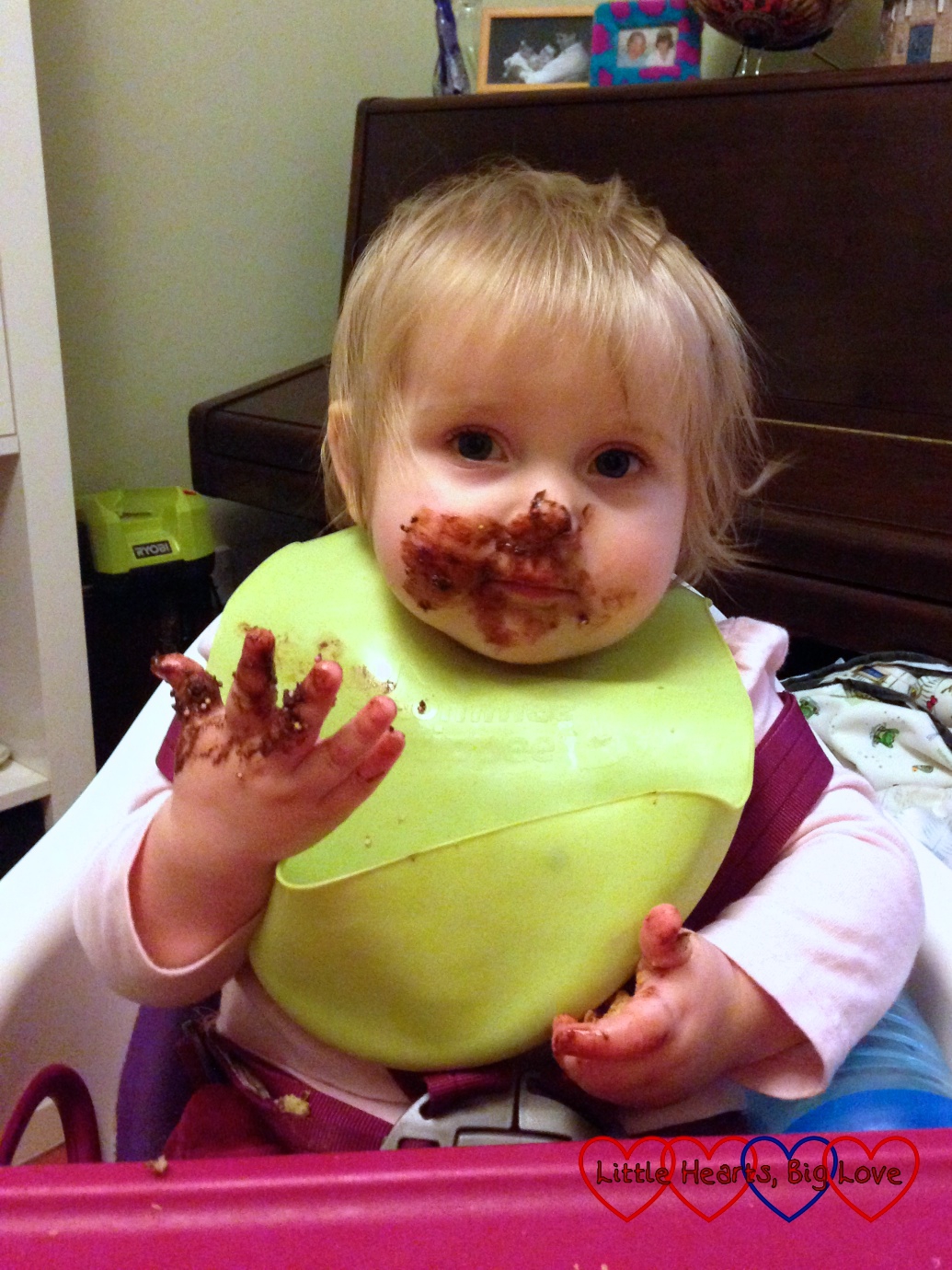Baby Sophie with her face covered in chocolate