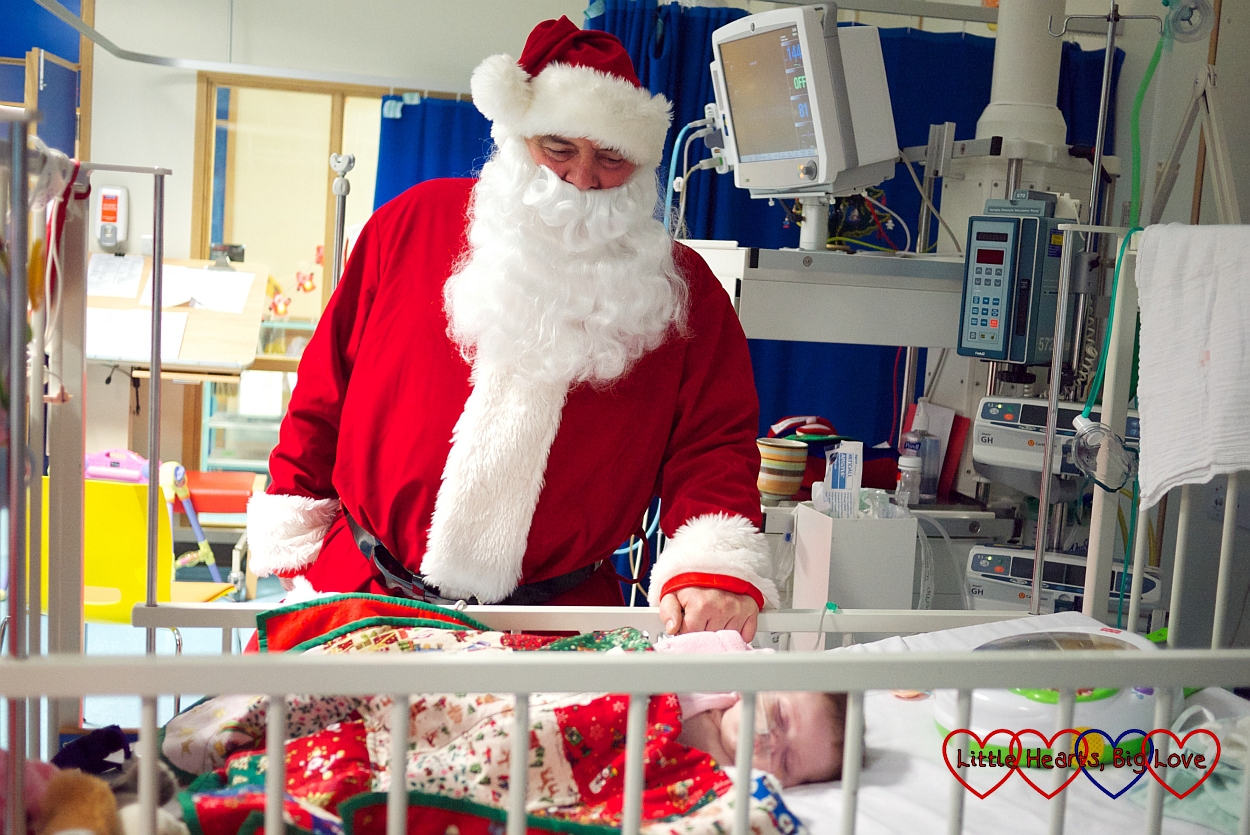 Father Christmas visiting Jessica in hospital