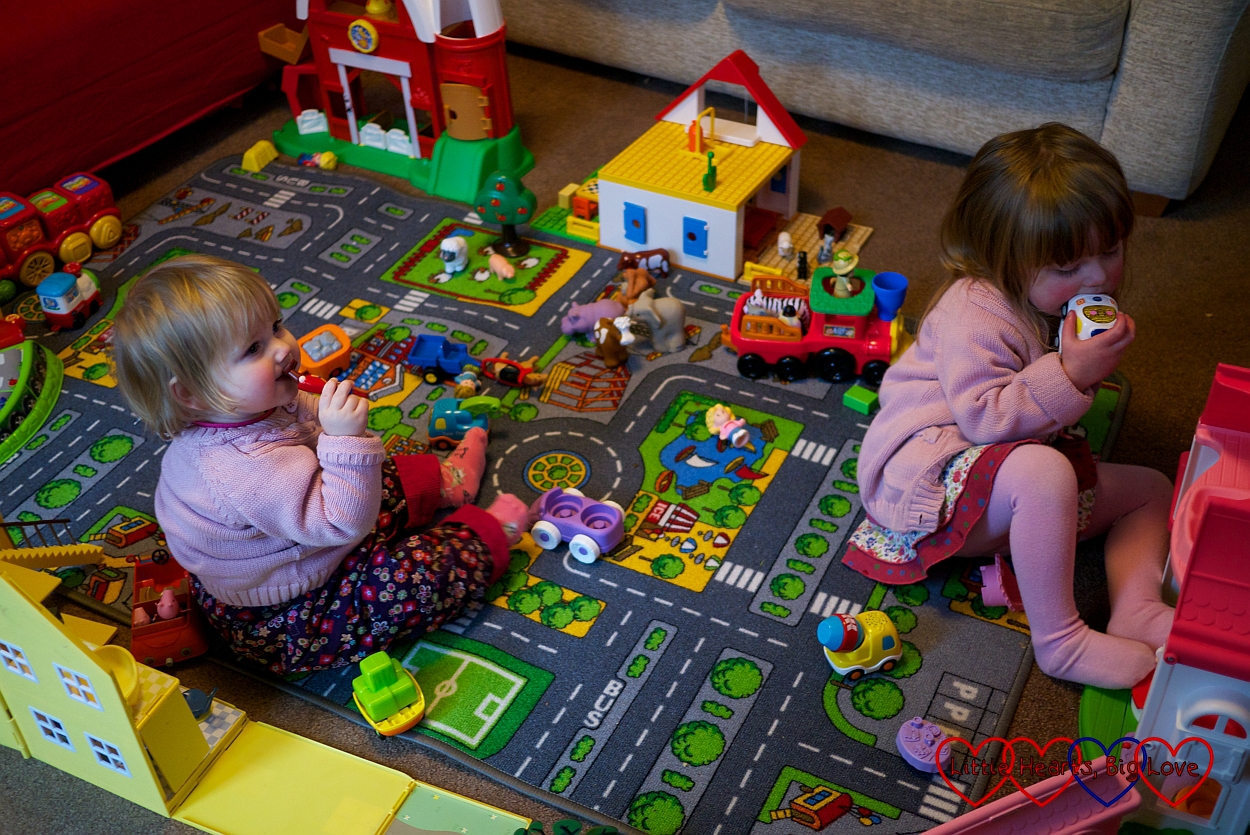 Imaginative play with a village of toys - Little Hearts, Big Love