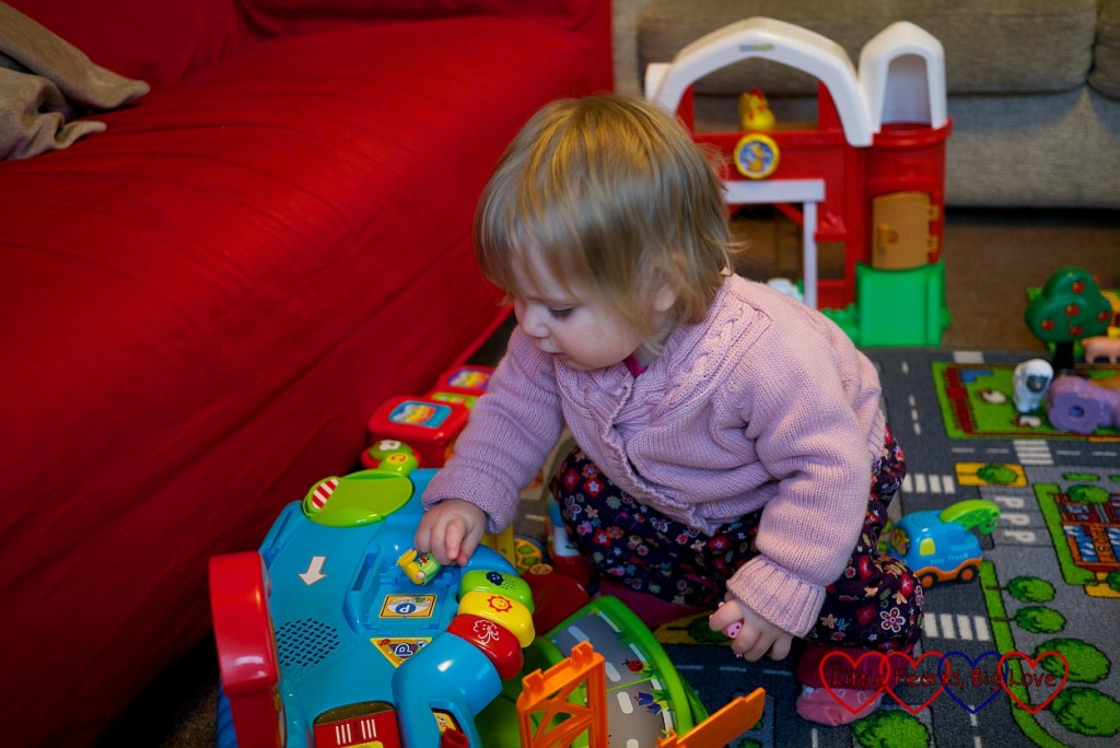 Imaginative play with a village of toys - Little Hearts, Big Love