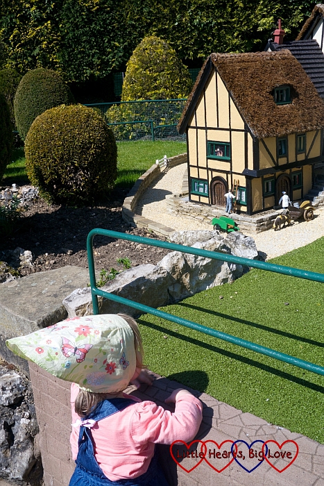 Sophie looking at the moving figures at Bekonscot model village