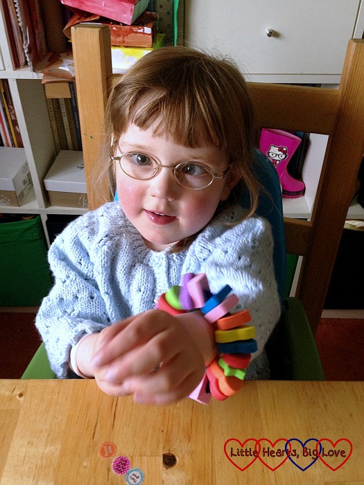 Making a bracelet using a pipe-cleaner and foam beads - a fabulous activity for toddlers and preschools to help with fine motor skills, counting skills and shape and colour recognition - Little Hearts, Big Love