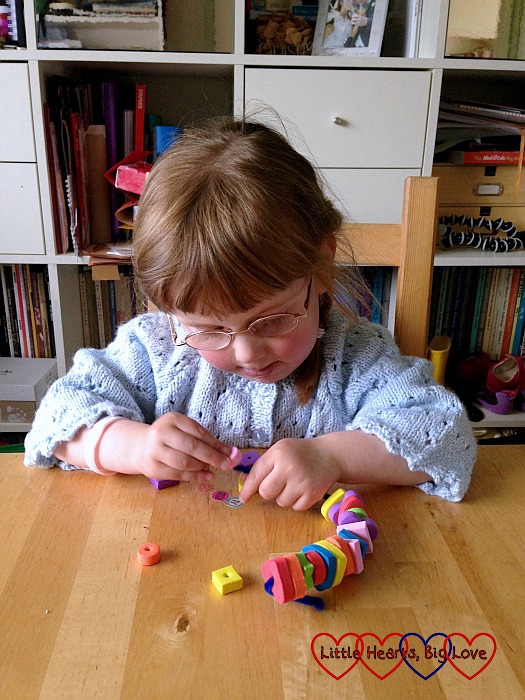 Making a bracelet using a pipe-cleaner and foam beads - a fabulous activity for toddlers and preschools to help with fine motor skills, counting skills and shape and colour recognition - Little Hearts, Big Love