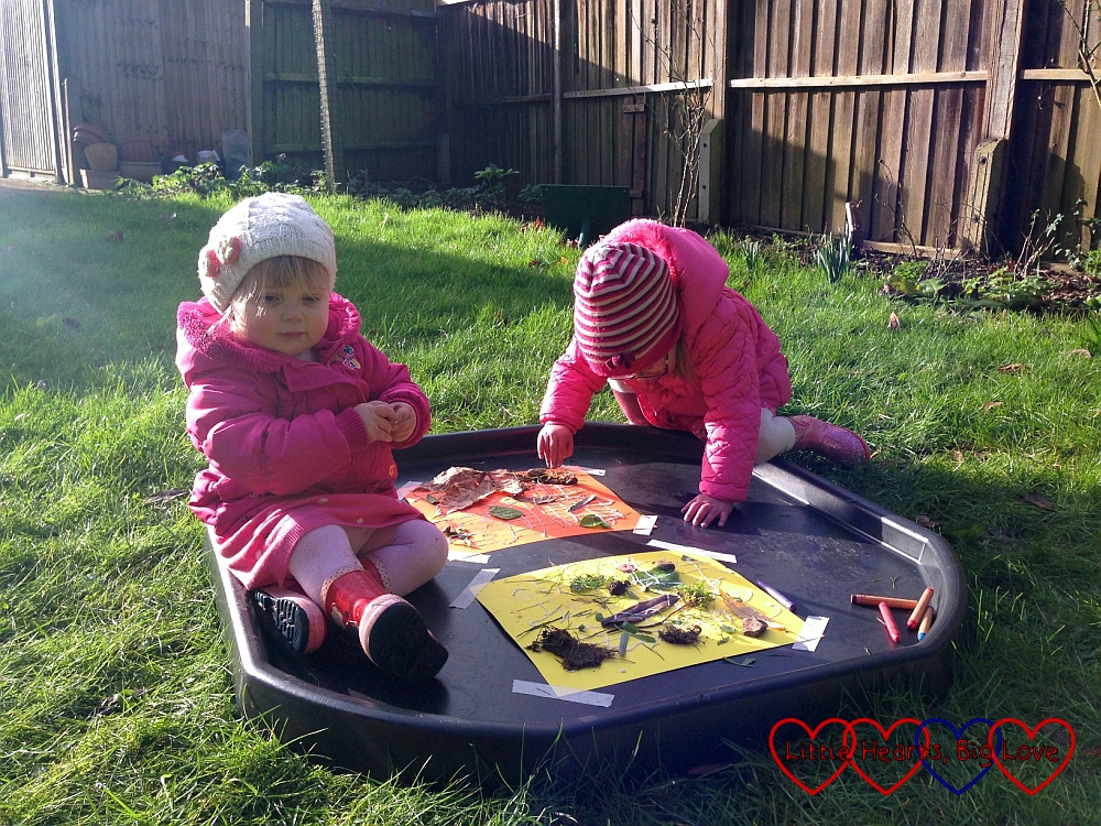 Sophie and Jessica creating a nature collage in the garden