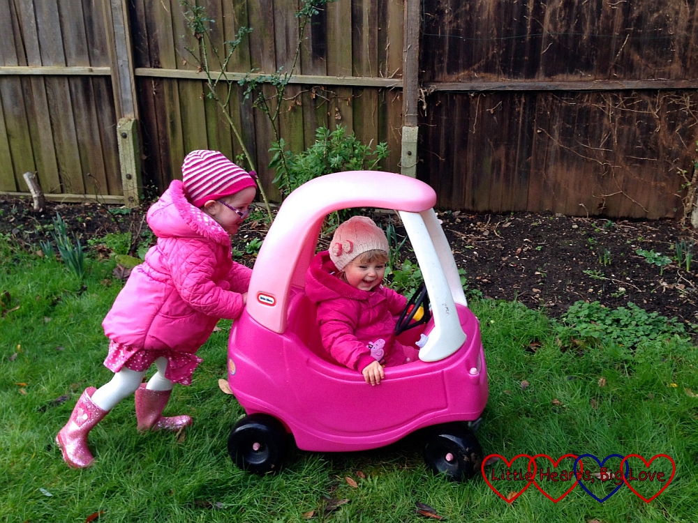 Playing with the cosy coupe car - Outdoor fun: creating a nature collage in the garden - Little Hearts, Big Love