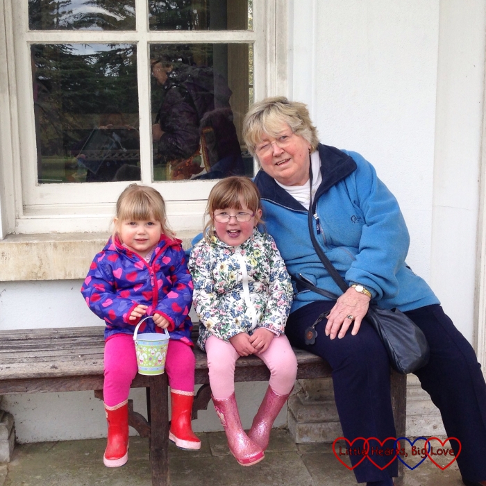 My girls sitting on a bench with Grandma whilst enjoying a day out at Osterley Park