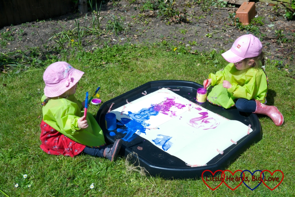 Painting in the back garden with the girls