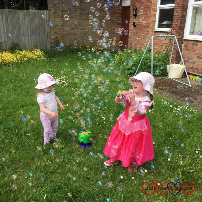 Having fun playing with bubbles in the garden