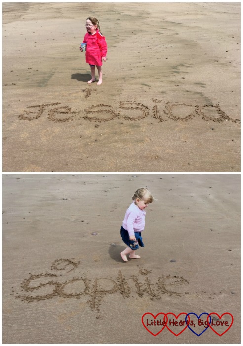 Two photos: Jessica at the top standing above her name written in the sand and Sophie at the bottom standing above her name written in the sand