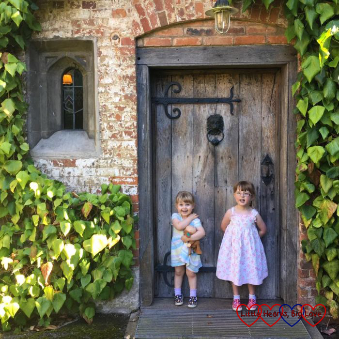 Jessica and Sophie standing in front of a pretty door at Baddesley Clinton