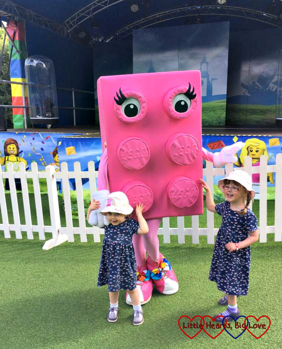 Jessica and Sophie with a giant pink brick at Legoland