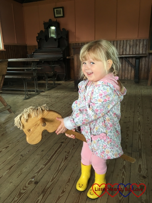Sophie riding a hobby horse at Chiltern Open Air Museum