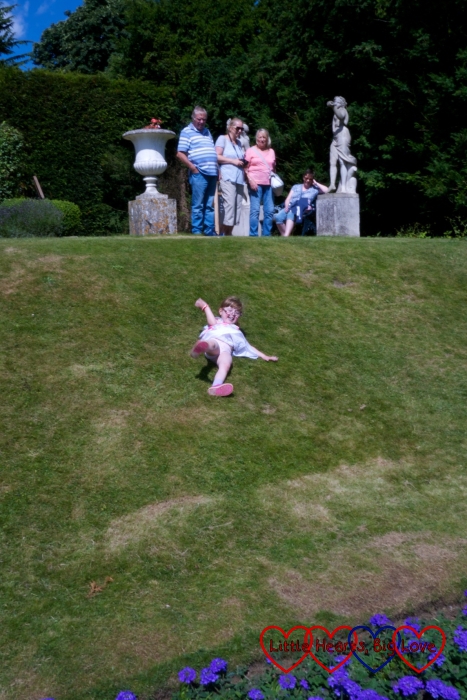 Jessica rolling down a hill at Hughenden Manor