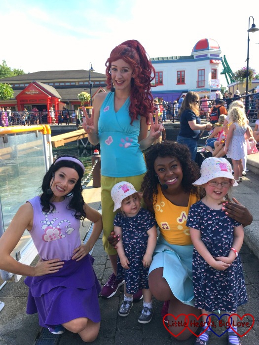 Jessica and Sophie posing with Emma, Mia and Andrea from the Lego Friends