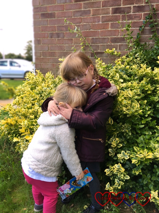Jessica giving Sophie a big cuddle after school