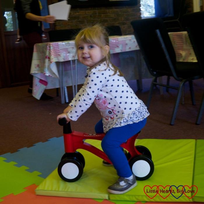 Sophie riding the Toddlebike2 at toddler group