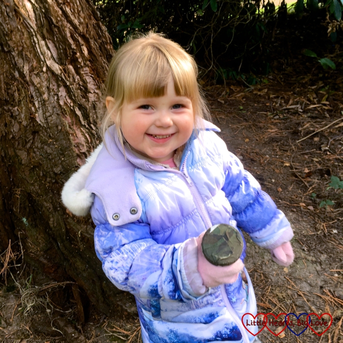 Sophie with a geocache that we found out on a walk