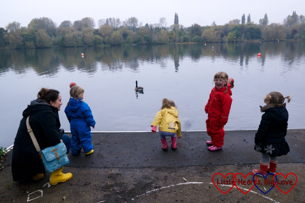 Mel and four children stopping to watch the geese in the lake