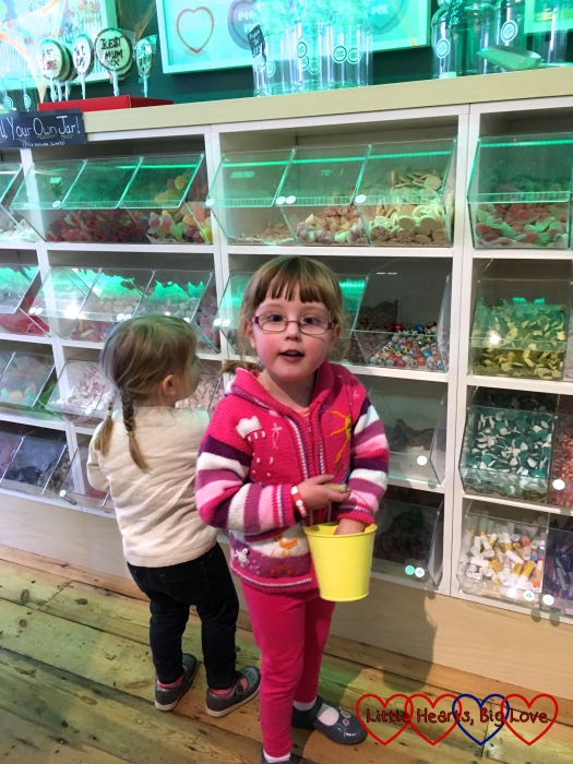 Jessica and Sophie choosing some sweets at Sweet as a Button in King's Langley