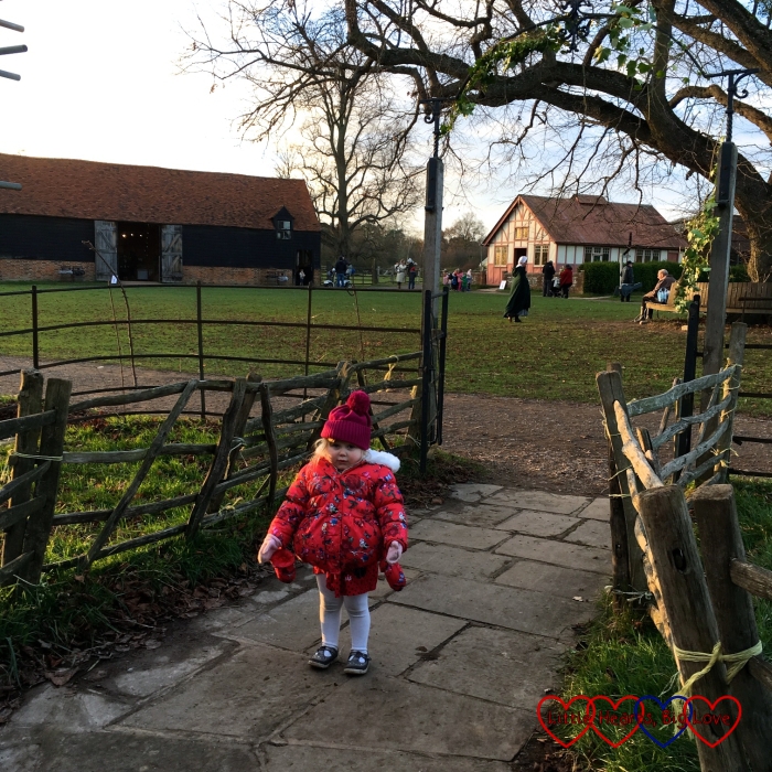 Sophie outside the Henton Mission Room on the village green at Chiltern Open Air Museum