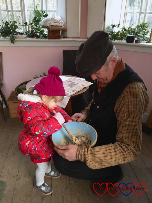 Sophie helping to stir the Christmas pudding at the Chiltern Open Air Museum