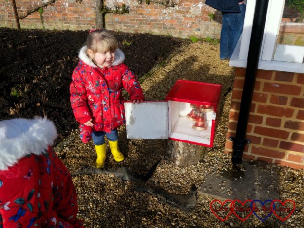Sophie opening one of the advent boxes at Hinton Ampner
