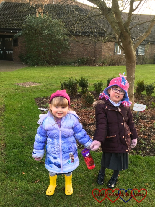 Jessica and Sophie in their coats and hats enjoying some time outside
