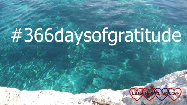 Blue waters of a lagoon with the text #366daysofgratitude