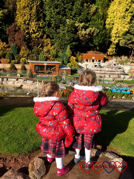 Jessica and Sophie looking at the miniature version of Paignton Zoo