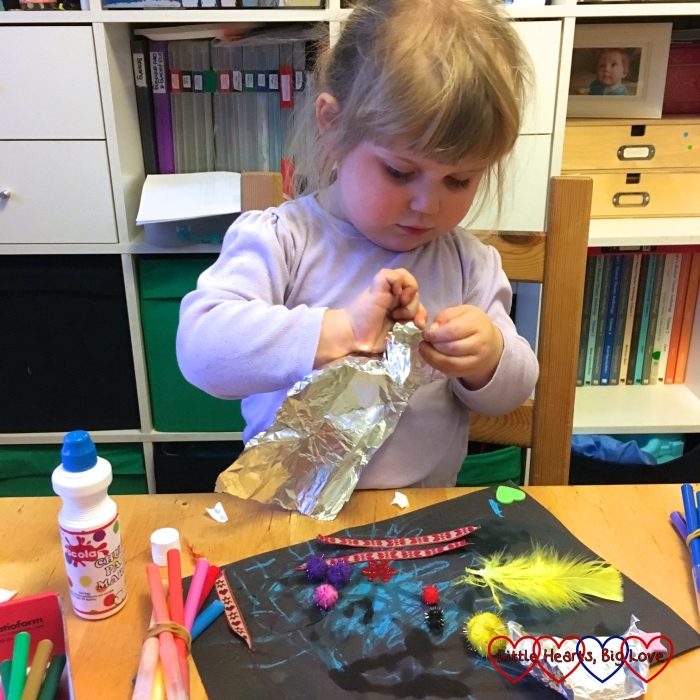 Sophie getting creative with the contents of her box from Children's Art Galleries